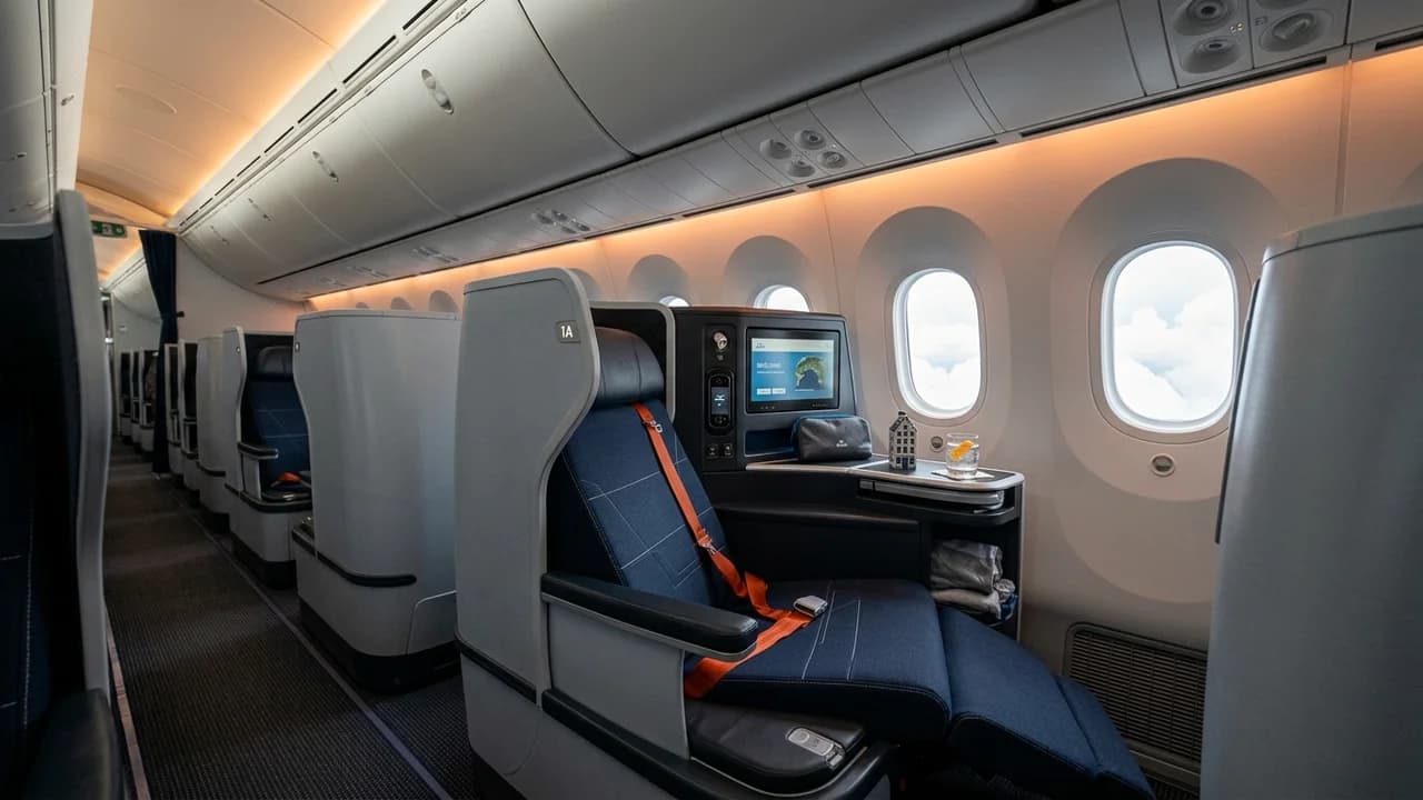 KLM business class cabin with lie-flat suite and premium amenities