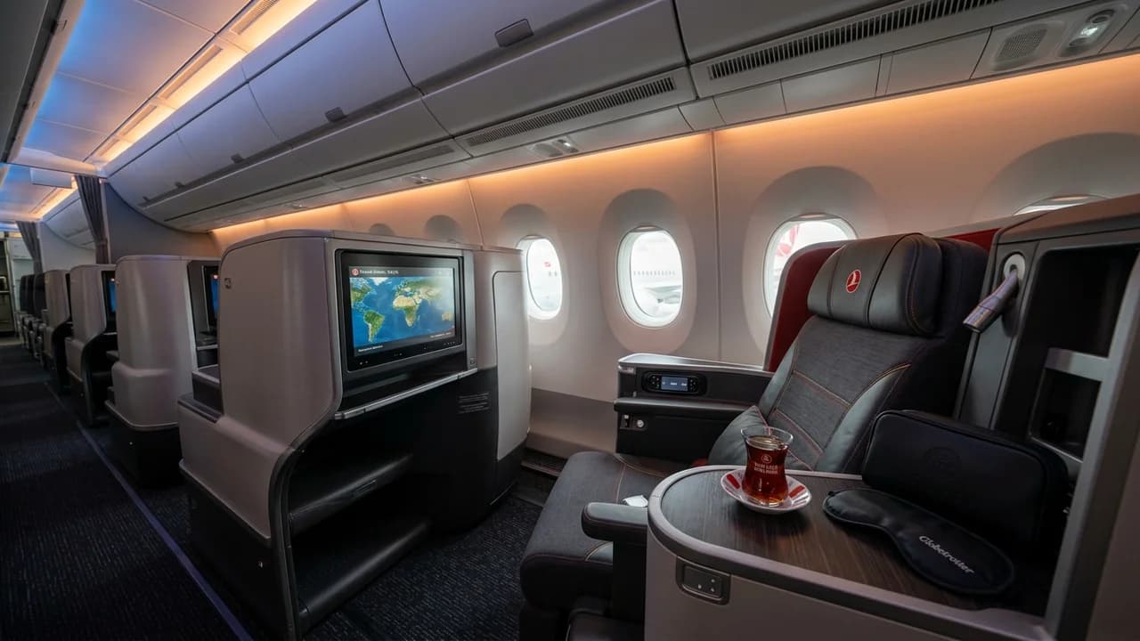 Turkish Airlines business class cabin with lie-flat suite and premium amenities