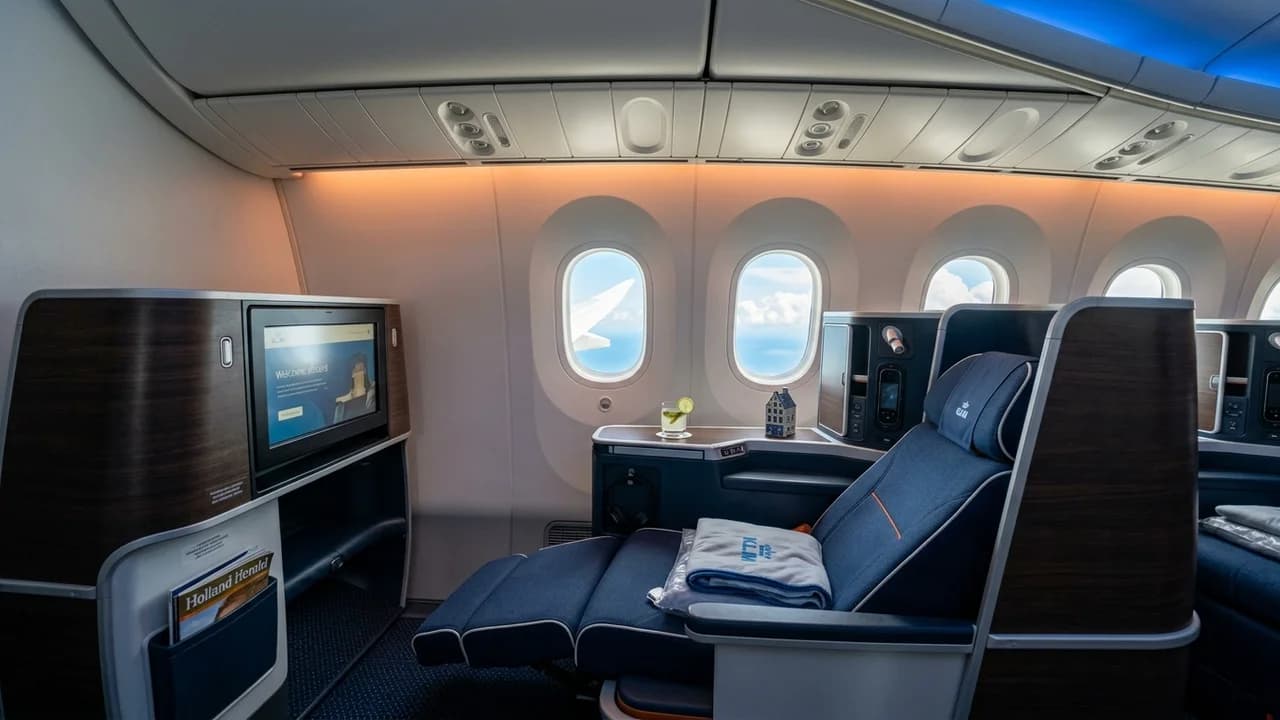 KLM business class cabin with lie-flat suite and premium amenities