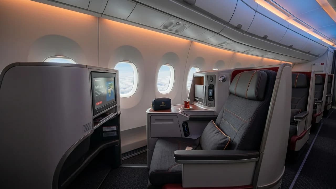 Turkish Airlines business class cabin with lie-flat suite and premium amenities