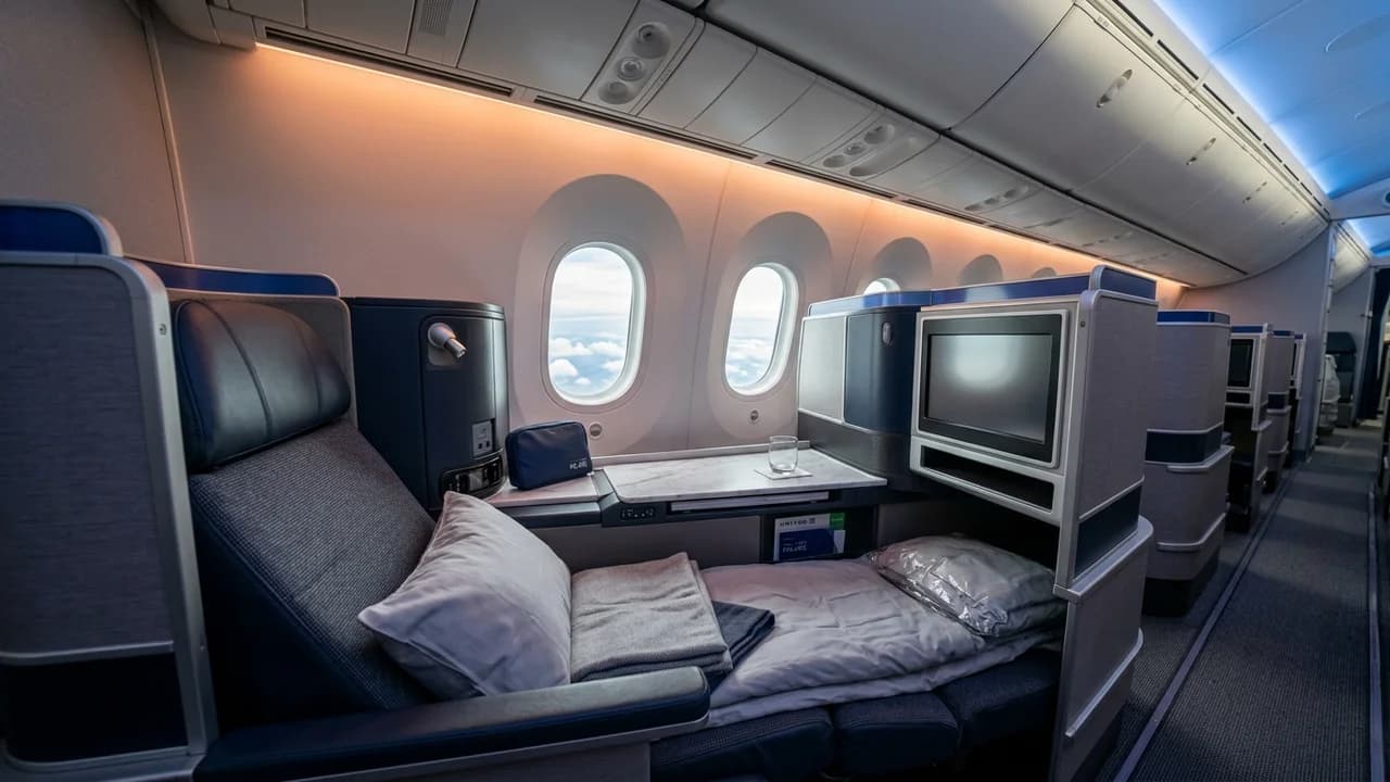 United business class cabin with lie-flat suite and premium amenities