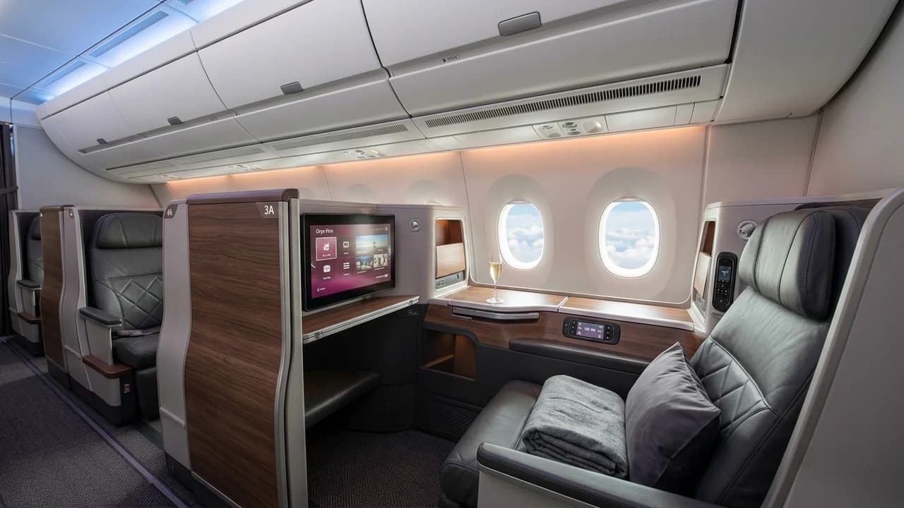 SWISS business class cabin with lie-flat suite and premium amenities